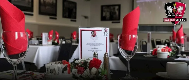 Không gian phòng VIP và khu vực hiếu khách tại sân St. James Park Exeter, thể hiện sự tiện nghi dành cho khách hàng cao cấp.